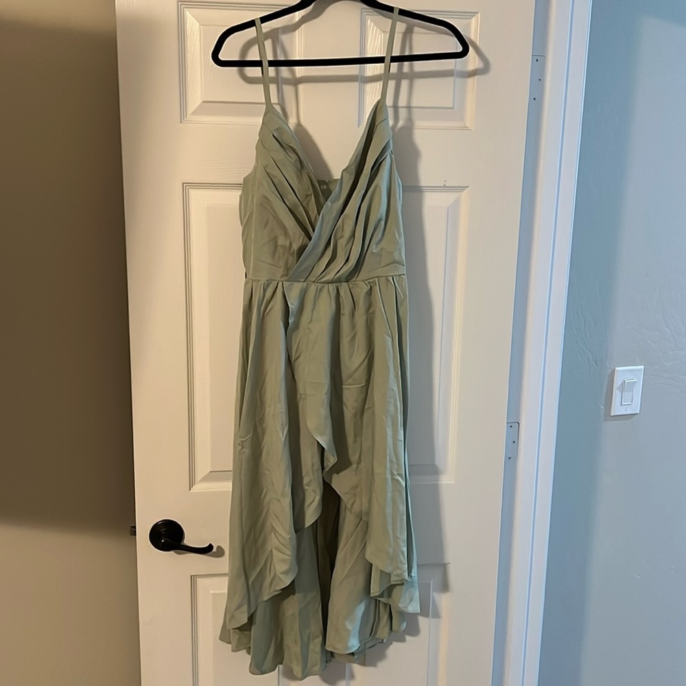 Short green semi- formal dress.
